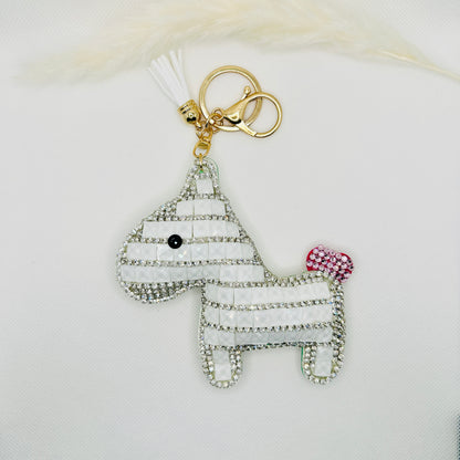 Porte-clés poney en strass. Breloque scintillante pour sac avec pompon et breloque.