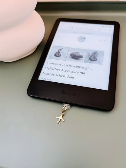 Flugzeug Charm aus vergoldeten Edelstahl. Minimalistisches Accessoire für Smartphone & Case.