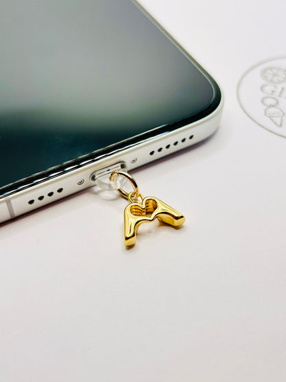 Stainless steel heart charm. Minimalist accessory for smartphones and cases.