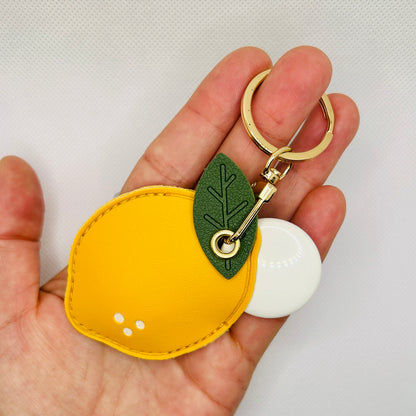 Zitronen Schlüsselanhänger mit Fach. Sommerliches Kunstleder-Etui für Kleingeld oder AirTag
