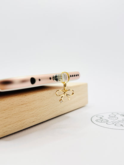 Schleifen Mini Charm in Gold. Verspielte Eleganz für dein Smartphone