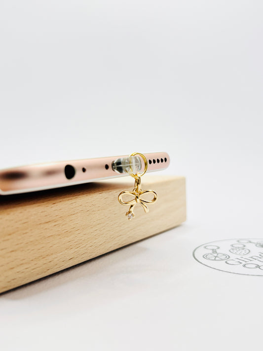 Schleifen Mini Charm in Gold. Verspielte Eleganz für dein Smartphone