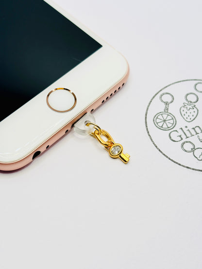 Schlüssel Handy Charm. Symbol für Vertrauen und Verbindung.