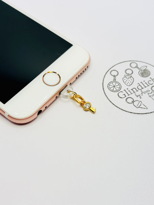 Schlüssel Handy Charm. Symbol für Vertrauen und Verbindung.