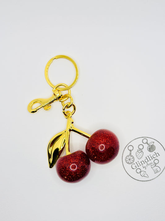 Kirsche Gold Bag Charm. Funkelnde Eleganz für deinen Schlüsselbund.